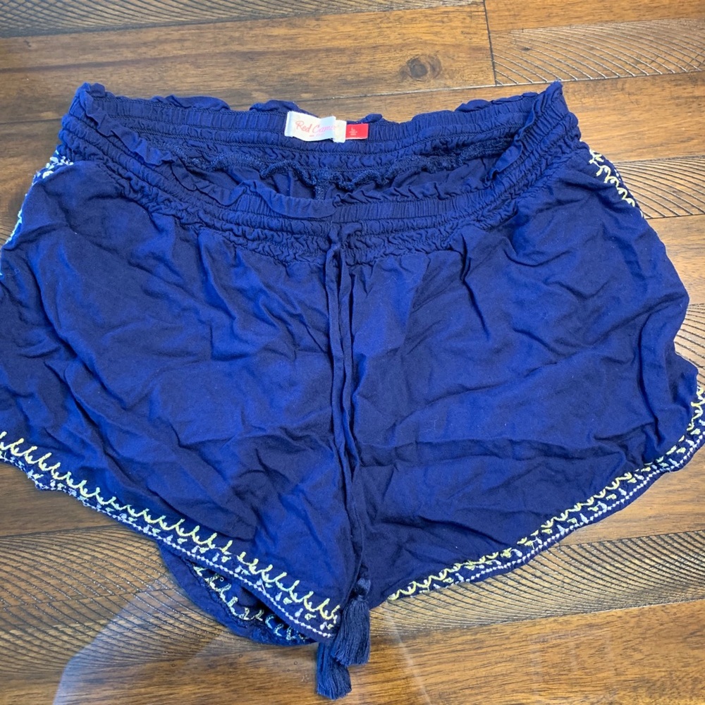 Blue embroidered shorts.